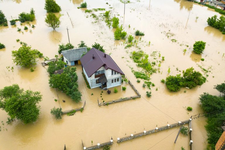 aerial-view-flooded-house-with-dirty-water-all-around-it-min